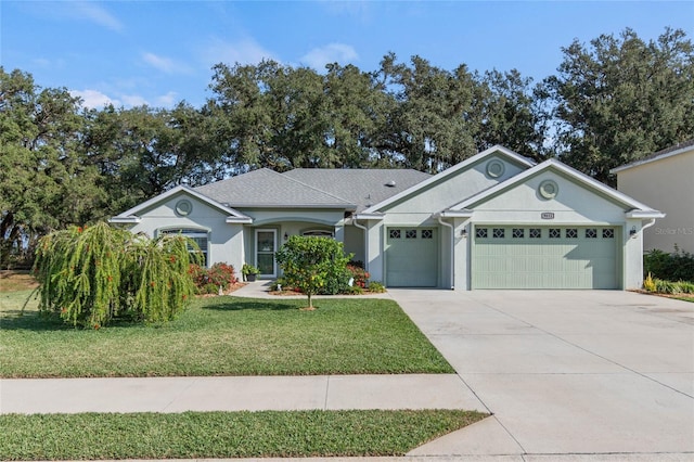 ranch-style house with a front yard and a garage