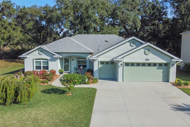 single story home featuring a front lawn and a garage