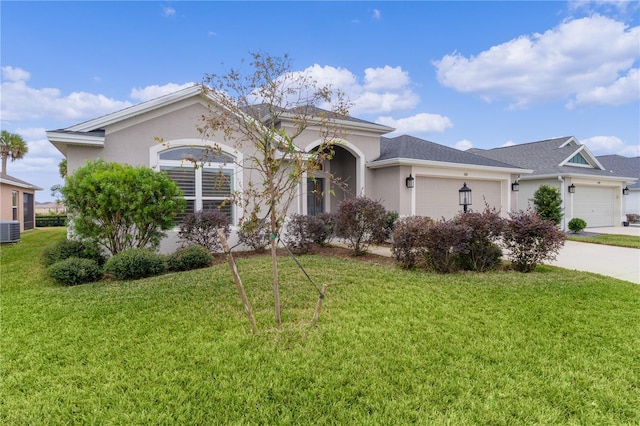 single story home featuring central air condition unit, a front yard, and a garage