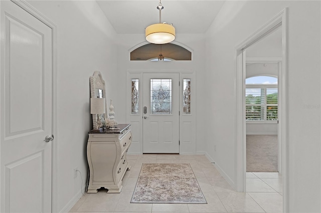 tiled foyer with plenty of natural light