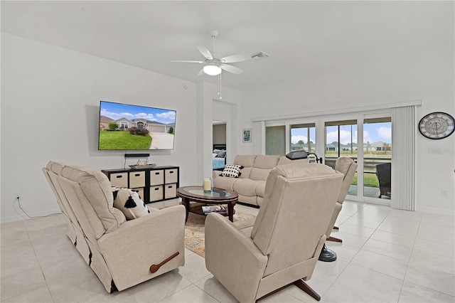 tiled living room featuring ceiling fan