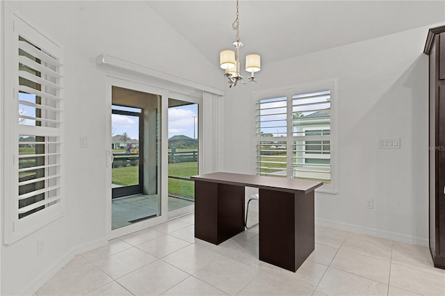 interior space with vaulted ceiling, light tile patterned flooring, and an inviting chandelier