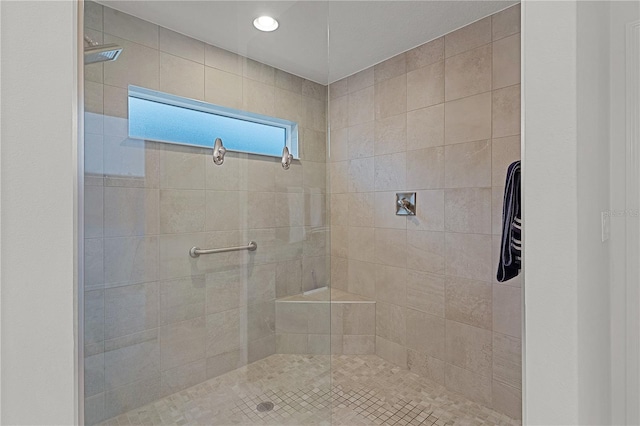 bathroom with a tile shower