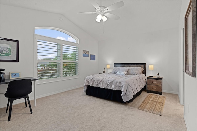 carpeted bedroom with vaulted ceiling and ceiling fan