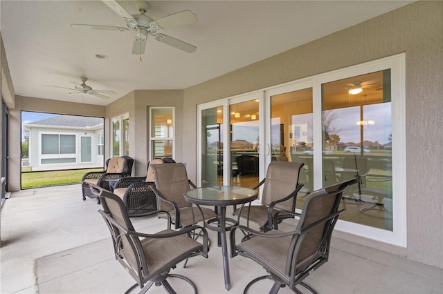 sunroom / solarium with ceiling fan