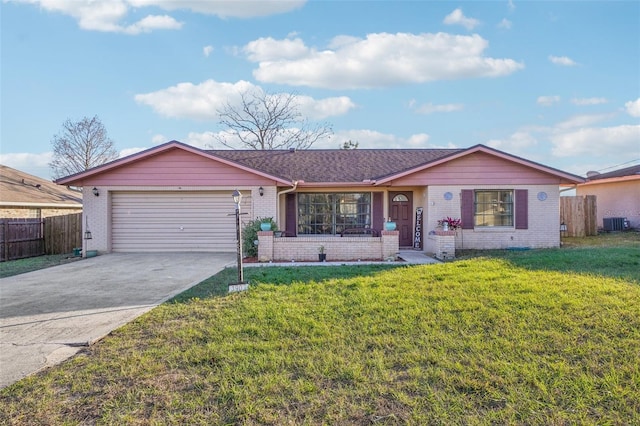 single story home with a garage, concrete driveway, brick siding, and a front yard