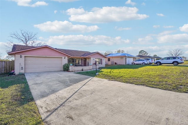 ranch-style home with driveway, an attached garage, fence, a front lawn, and brick siding