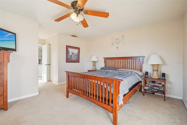 bedroom with baseboards, ceiling fan, visible vents, and light colored carpet