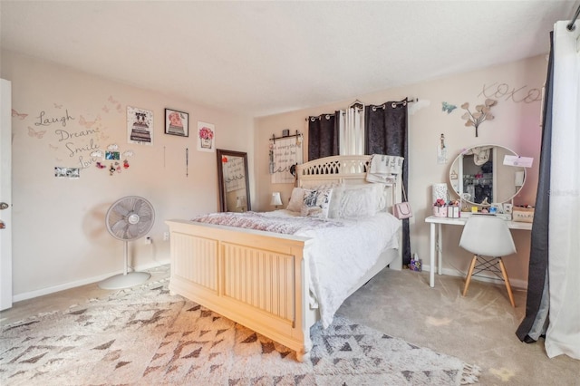 carpeted bedroom featuring baseboards