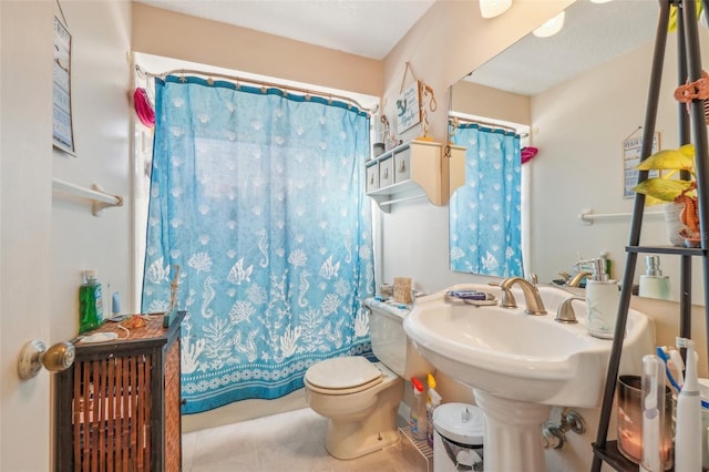 full bath with toilet and tile patterned floors