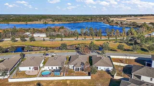 birds eye view of property featuring a water view