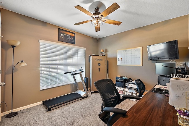 office space featuring ceiling fan and carpet