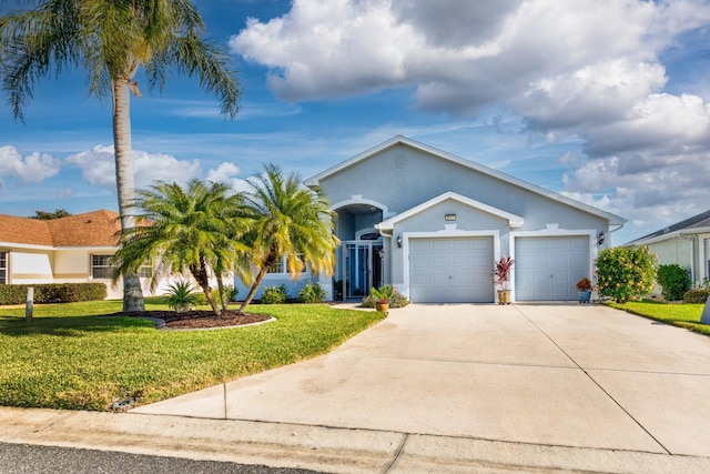 single story home featuring a garage and a front lawn