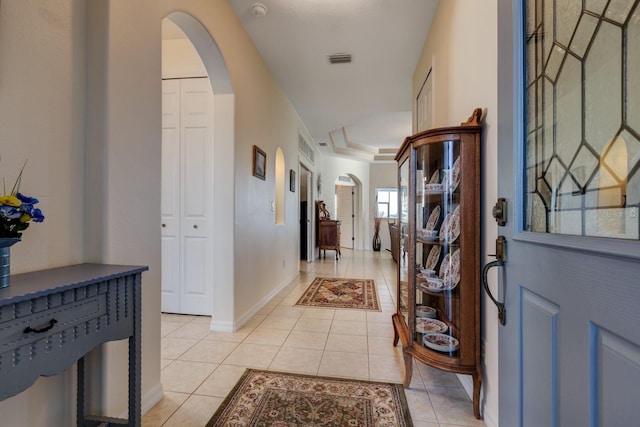 foyer with light tile patterned floors