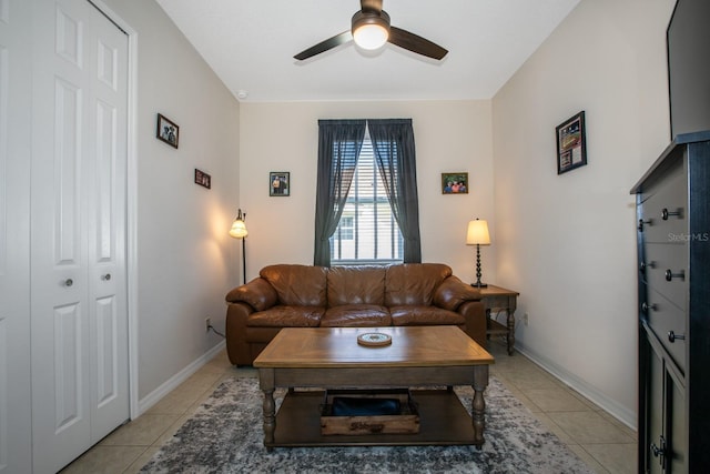 tiled living room with ceiling fan