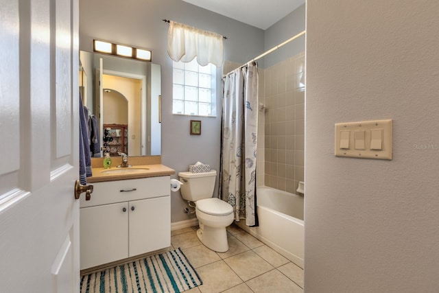 full bathroom with shower / bathtub combination with curtain, tile patterned flooring, vanity, and toilet