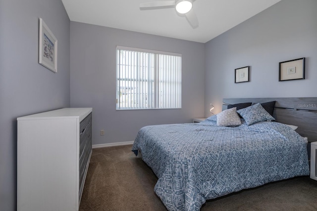 bedroom featuring ceiling fan and dark carpet