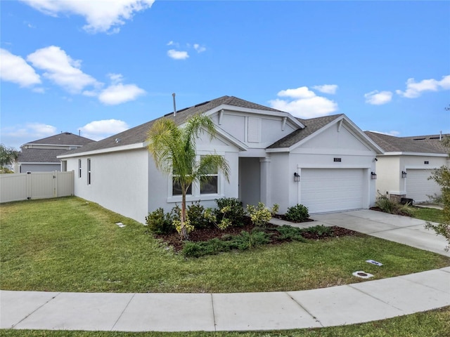 view of front of home featuring a front yard and a garage