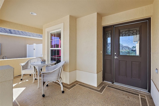 entrance to property featuring covered porch