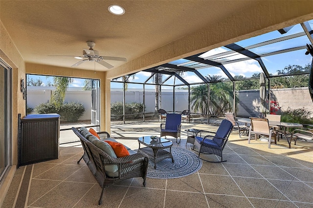 view of patio featuring ceiling fan, a lanai, and an outdoor hangout area