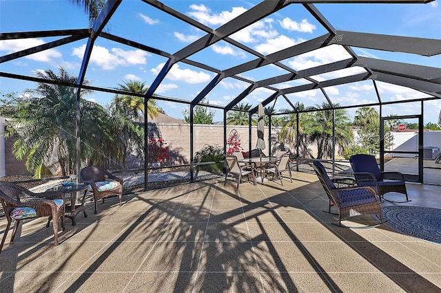 view of patio / terrace featuring a lanai