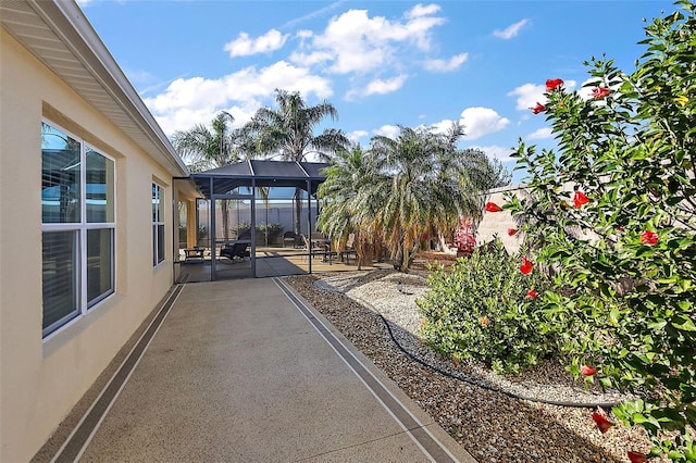 view of patio / terrace with glass enclosure