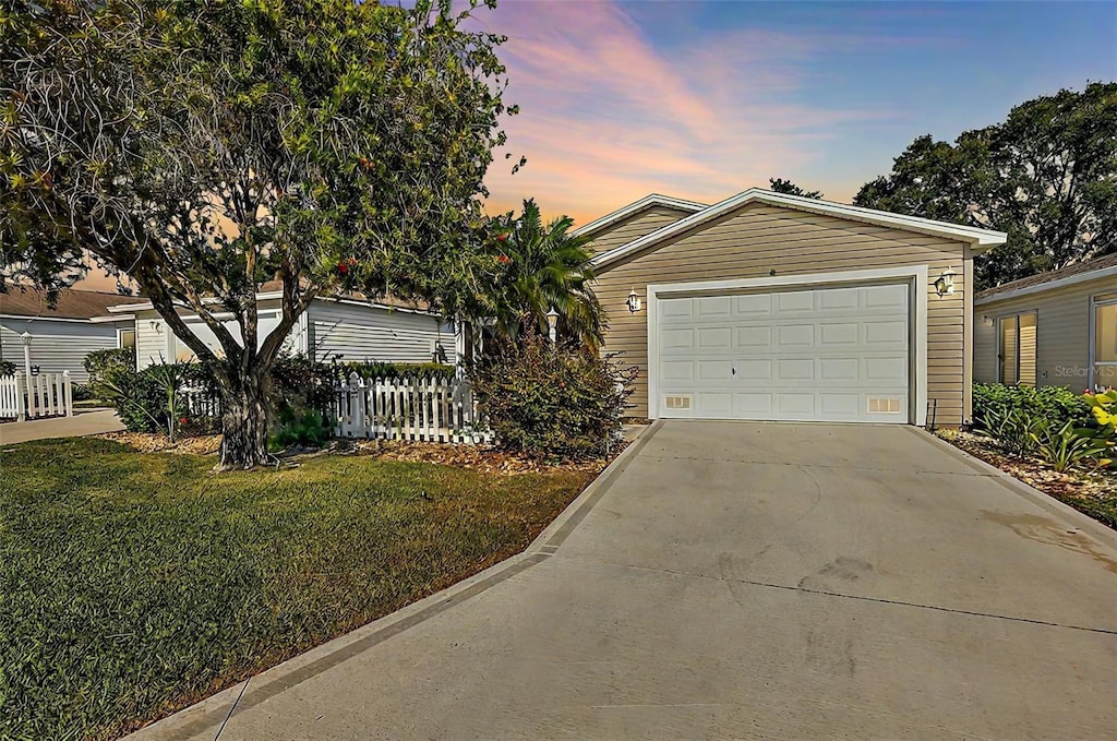 ranch-style house with a yard