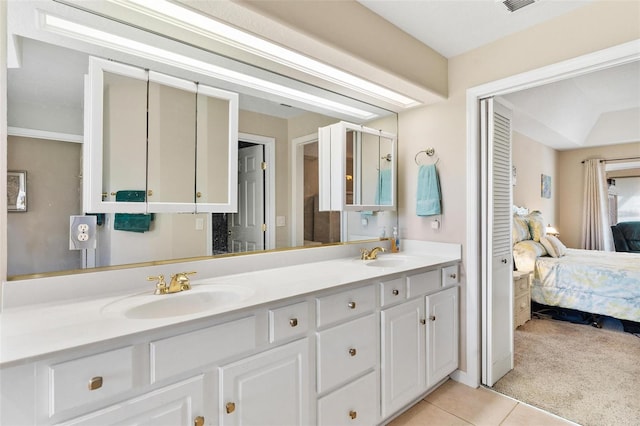 bathroom with tile patterned flooring and vanity