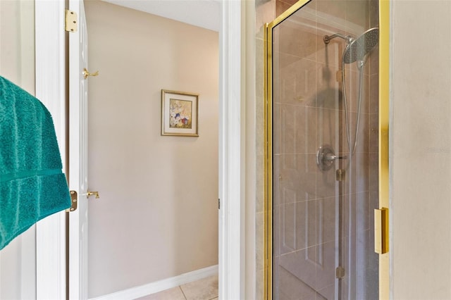 bathroom featuring tile patterned flooring and a shower with shower door