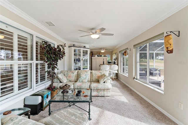 living room featuring ceiling fan, carpet floors, and ornamental molding