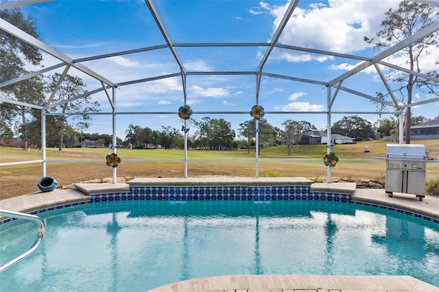 view of swimming pool featuring glass enclosure and a grill