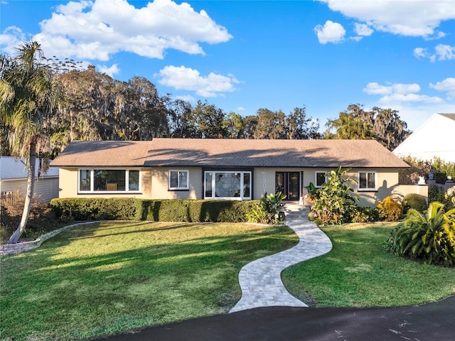 ranch-style house with a front lawn