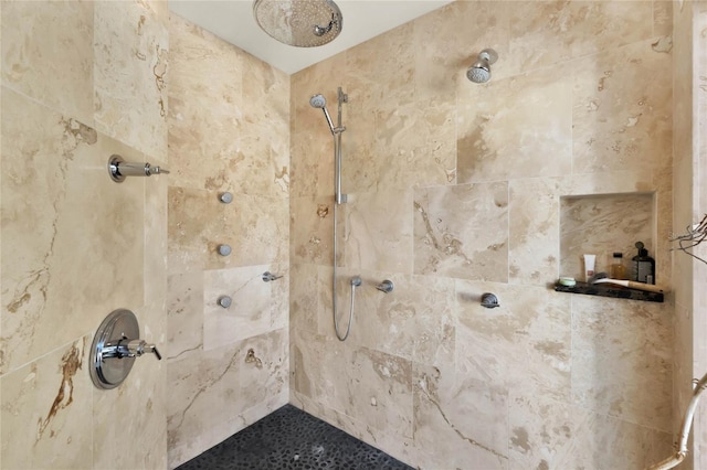 bathroom with tiled shower