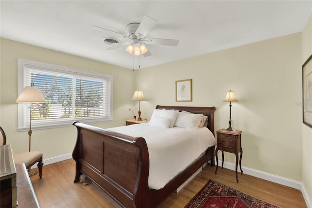 bedroom featuring ceiling fan and light hardwood / wood-style floors