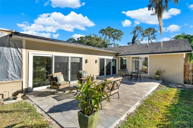 back of property featuring a patio area