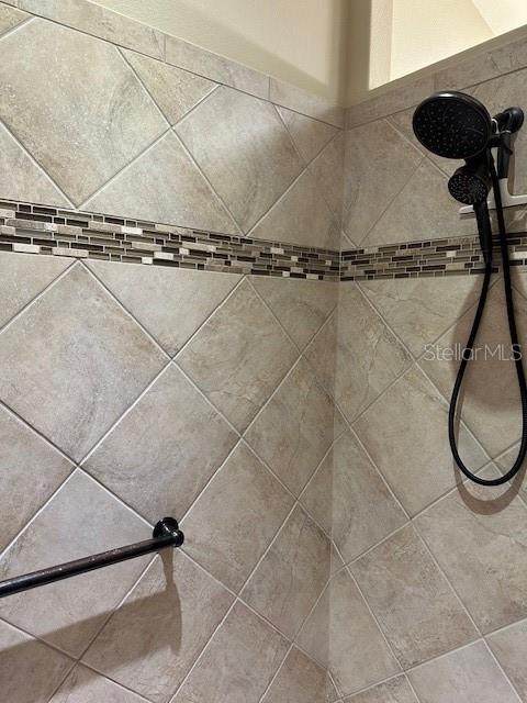 room details with a tile shower