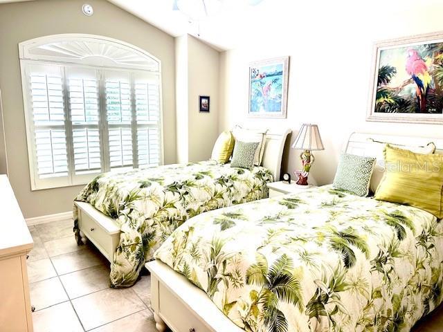 bedroom featuring light tile patterned floors