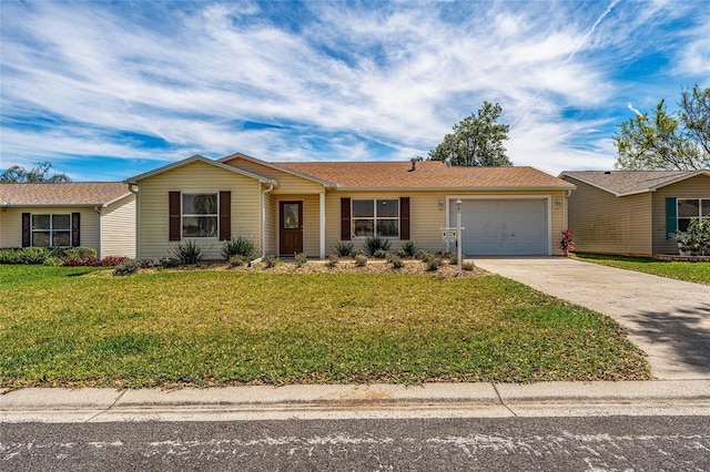 single story home with a garage and a front lawn