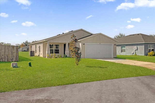 ranch-style home with a garage, a front lawn, and central air condition unit