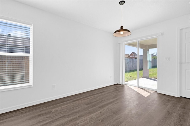 unfurnished room featuring dark hardwood / wood-style flooring