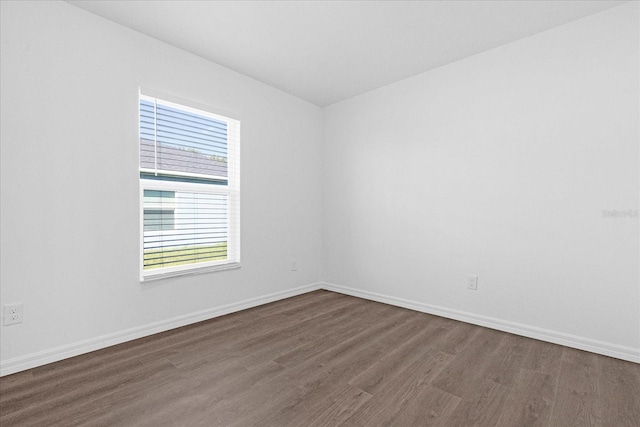 empty room featuring dark wood-type flooring