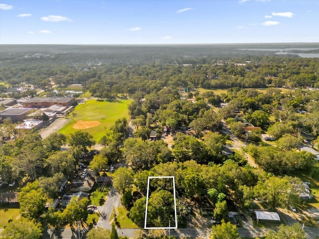 drone / aerial view featuring a view of trees