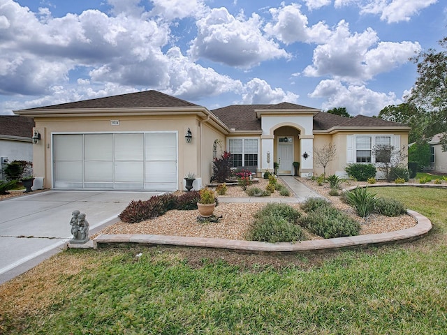 ranch-style house with a front yard and a garage