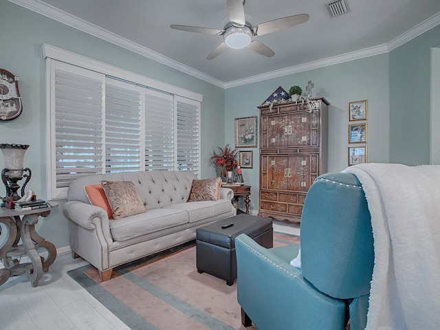 living room featuring ceiling fan and crown molding