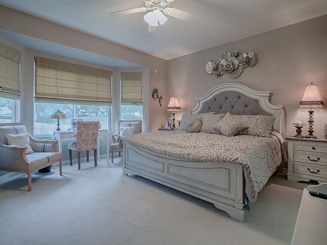 bedroom with light colored carpet and ceiling fan