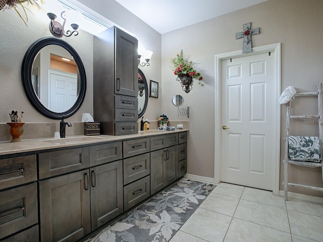 bathroom with tile patterned flooring and vanity