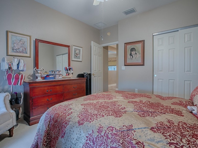 carpeted bedroom featuring a closet and ceiling fan