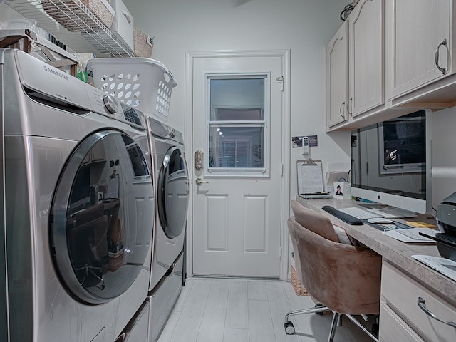 laundry room featuring cabinets and independent washer and dryer