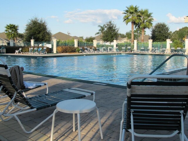 view of swimming pool featuring a patio area