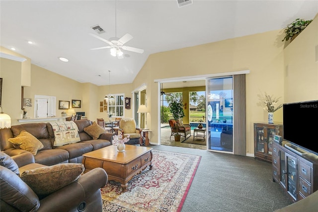 carpeted living room with high vaulted ceiling and ceiling fan